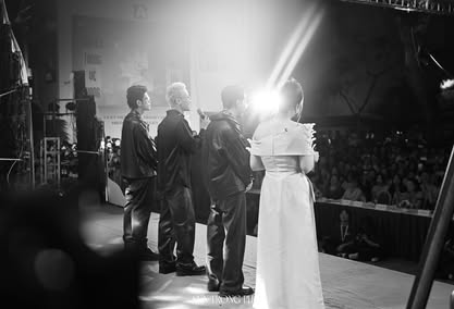 May be a black-and-white image of 5 people, lighting and wedding